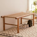 A wooden entryway bench with a woven rope seat
